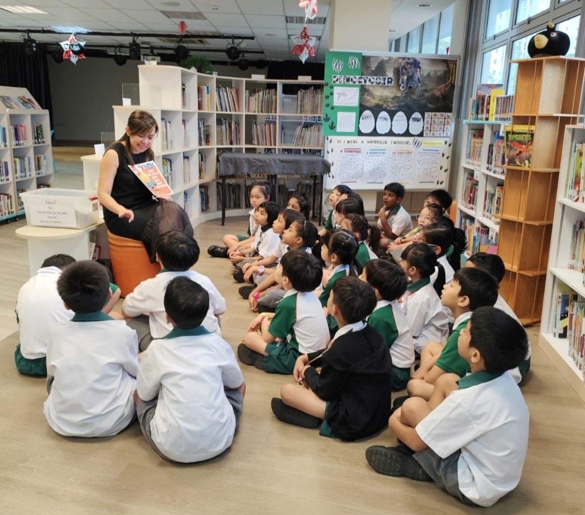 Students immersed in an engaging storytelling session, nurturing a love for reading, imagination and lifelong learning.